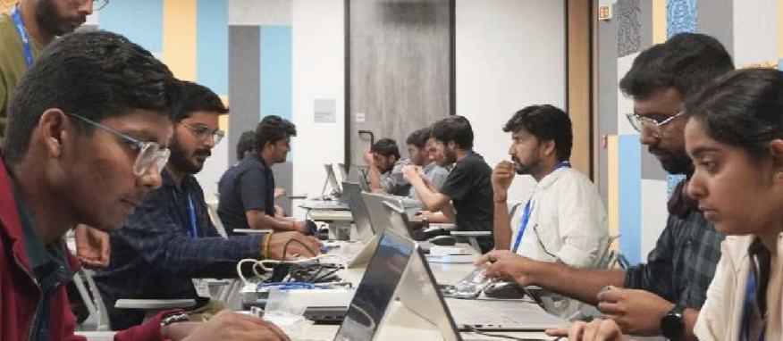 Teams heads-down at laptops during a DevAarambh buildathon